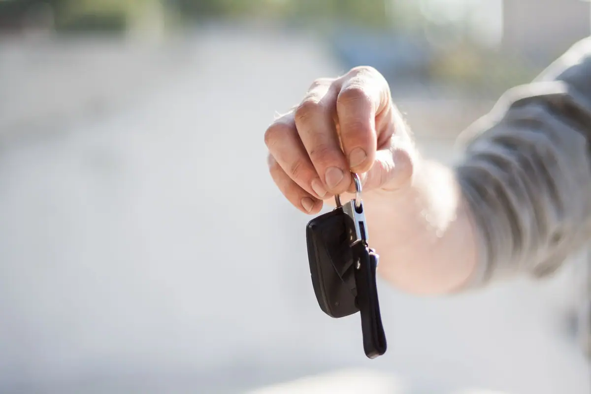 Car keys being handed over