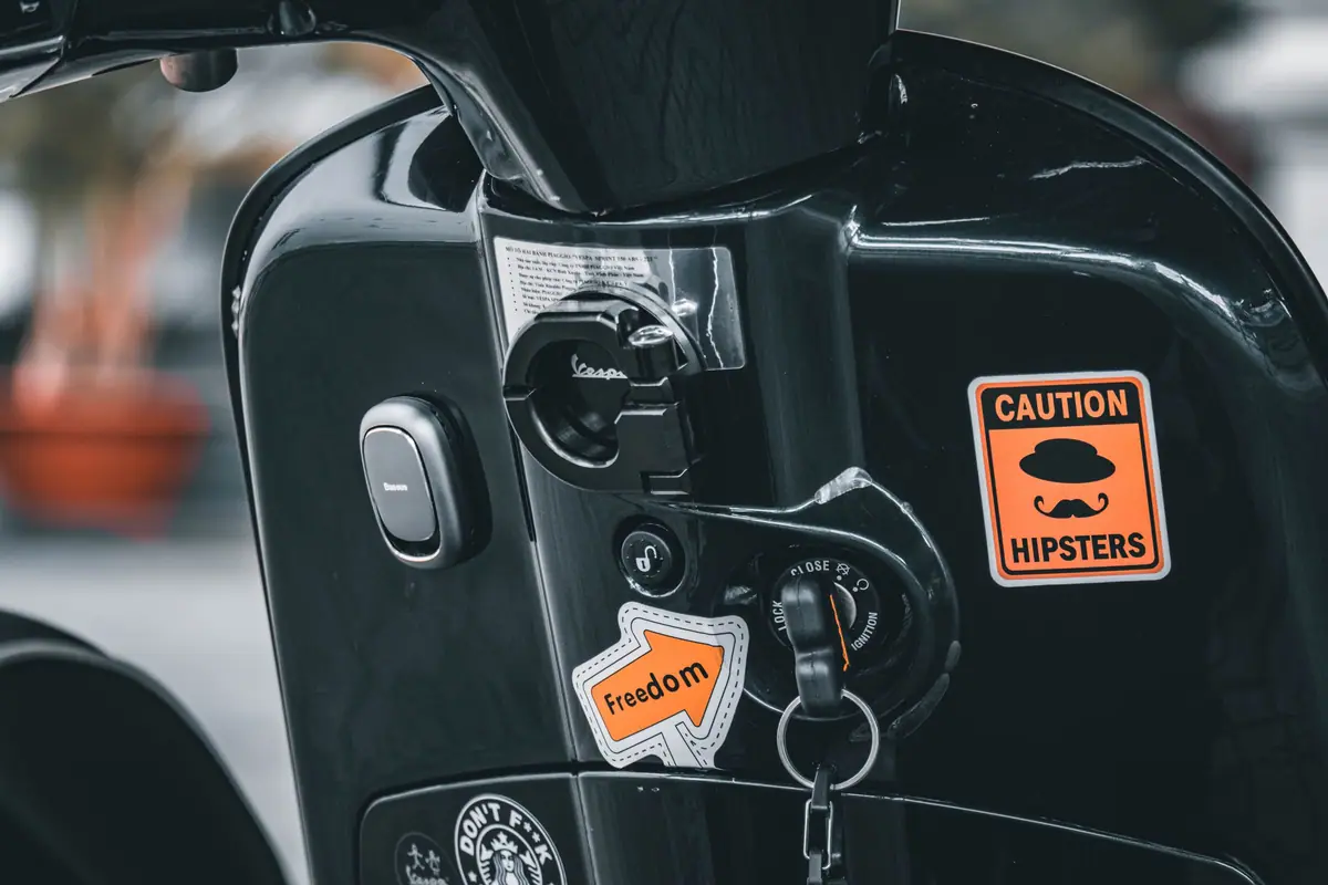 A key in the ignition of a scooter