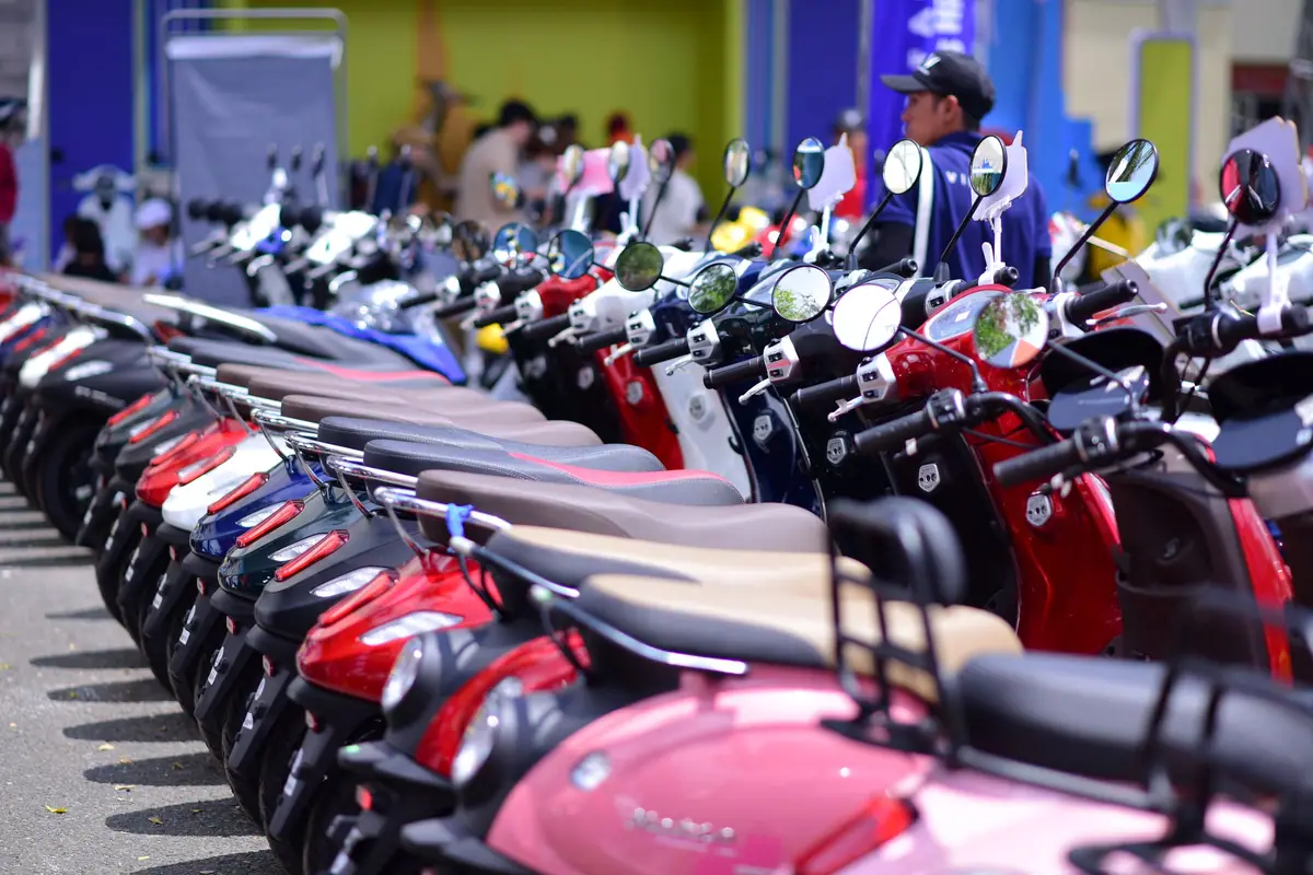 A long row of scooters parked side by side